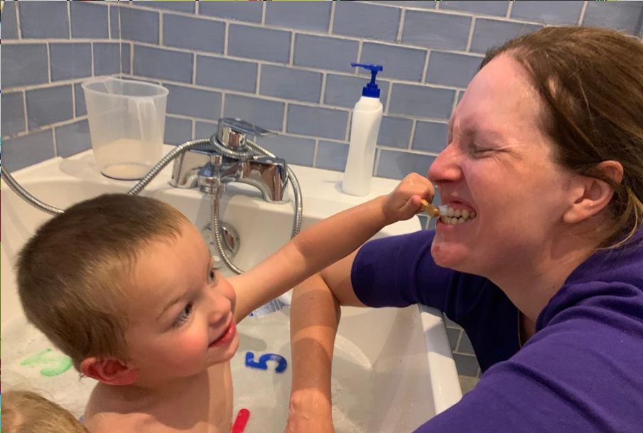 Leo Brushing their mums teeth