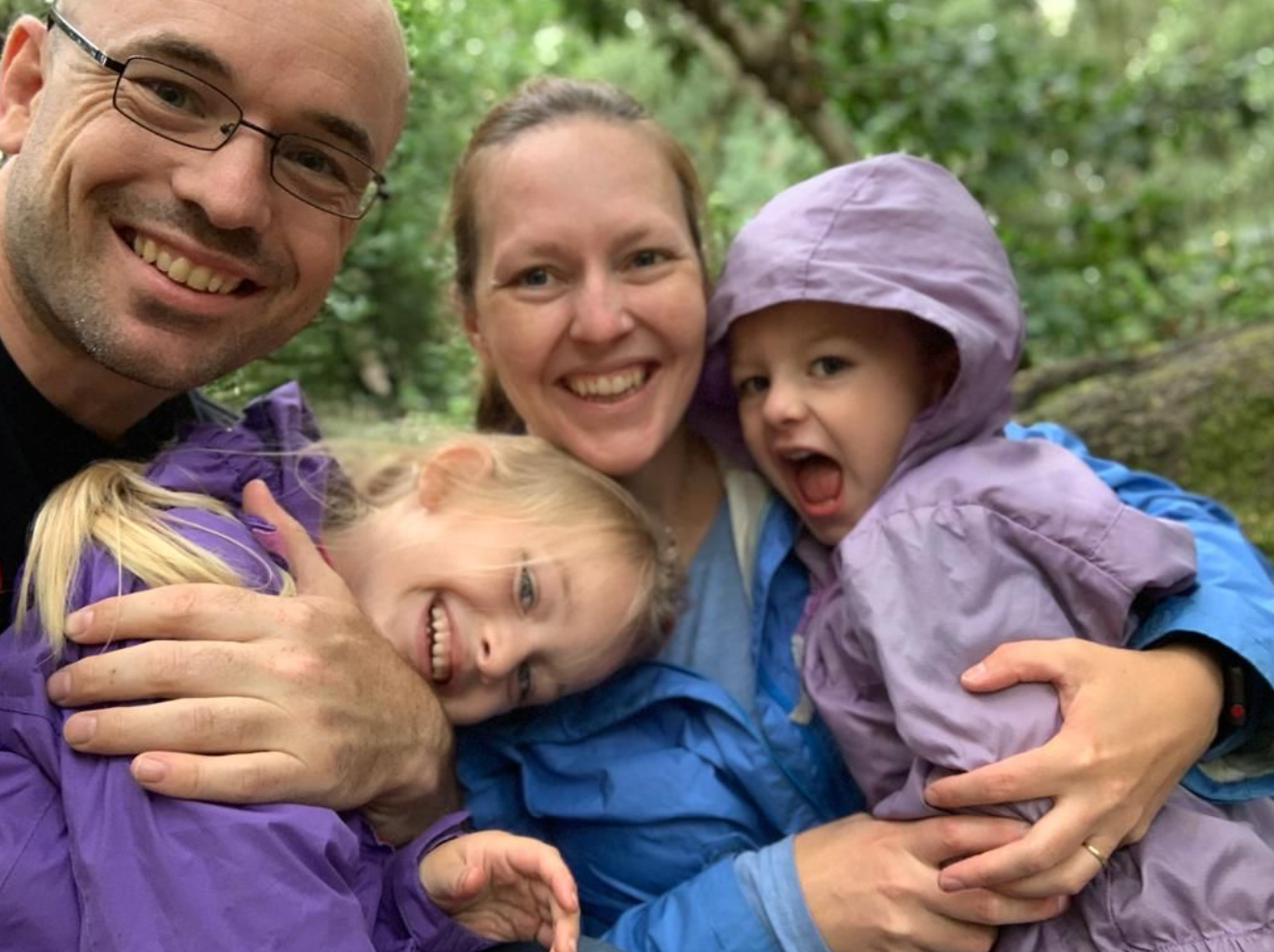 Family photo in a rainy forest