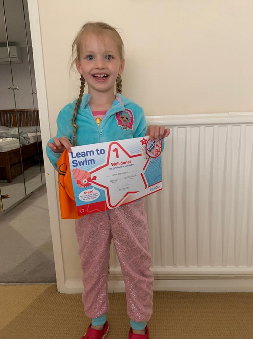 Nova with their swimming certificate