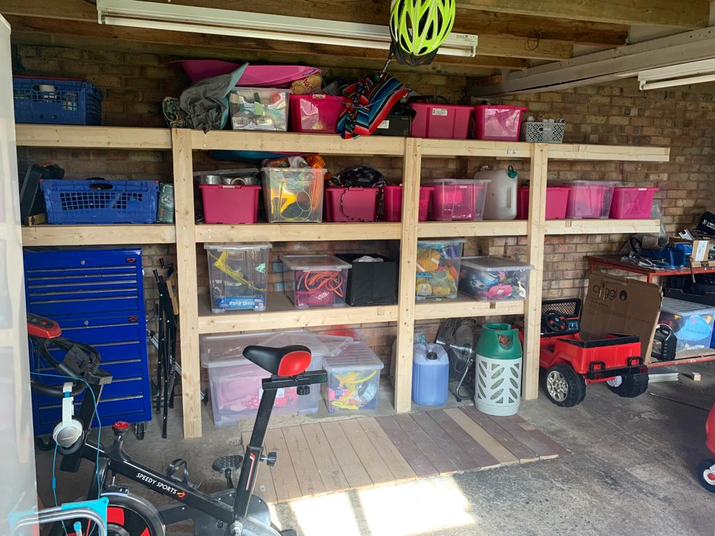 A garage with wooden shelves in it